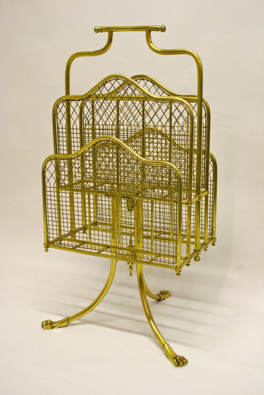 An unusual and very decorative late 19th century gilt lacquered brass canterbury.
