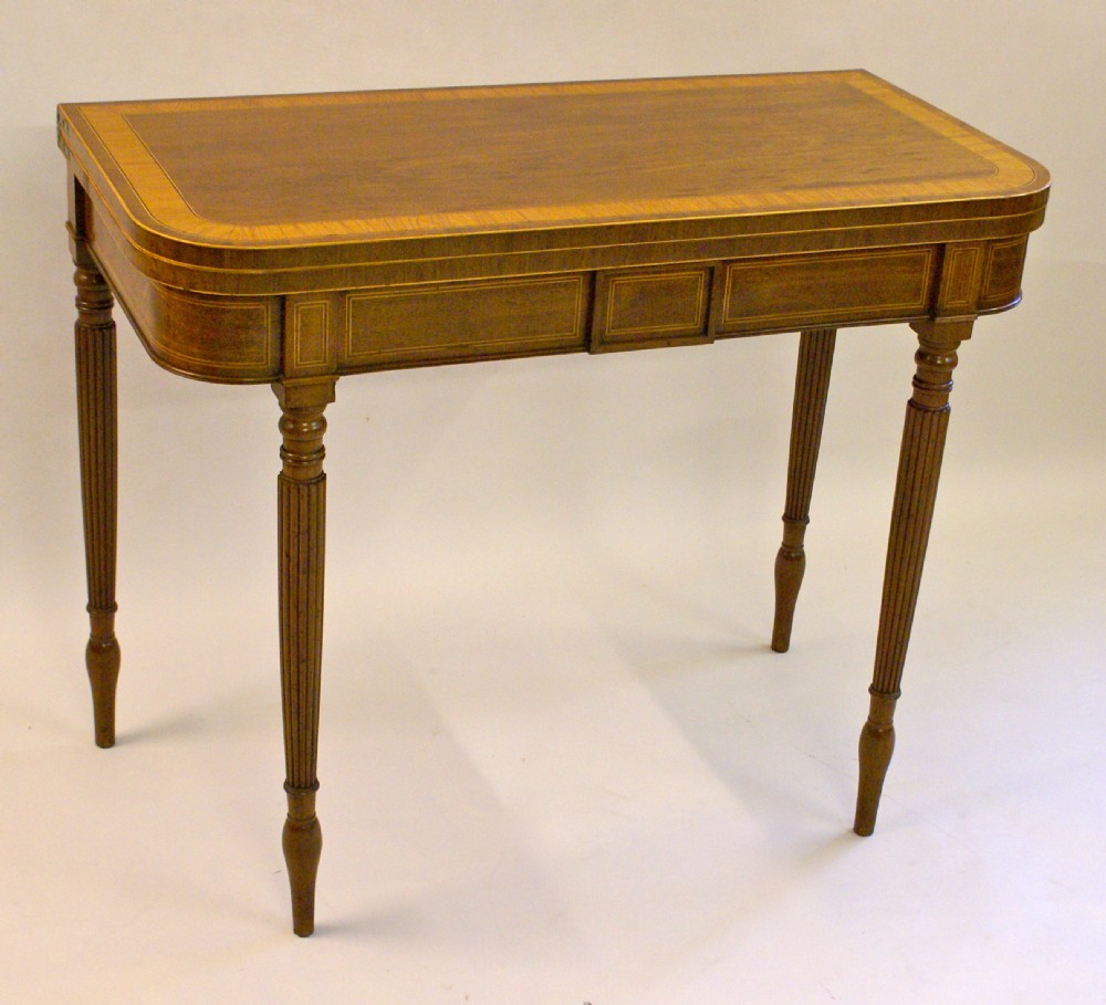 An elegant Sheraton period mahogany and satinwood tea table