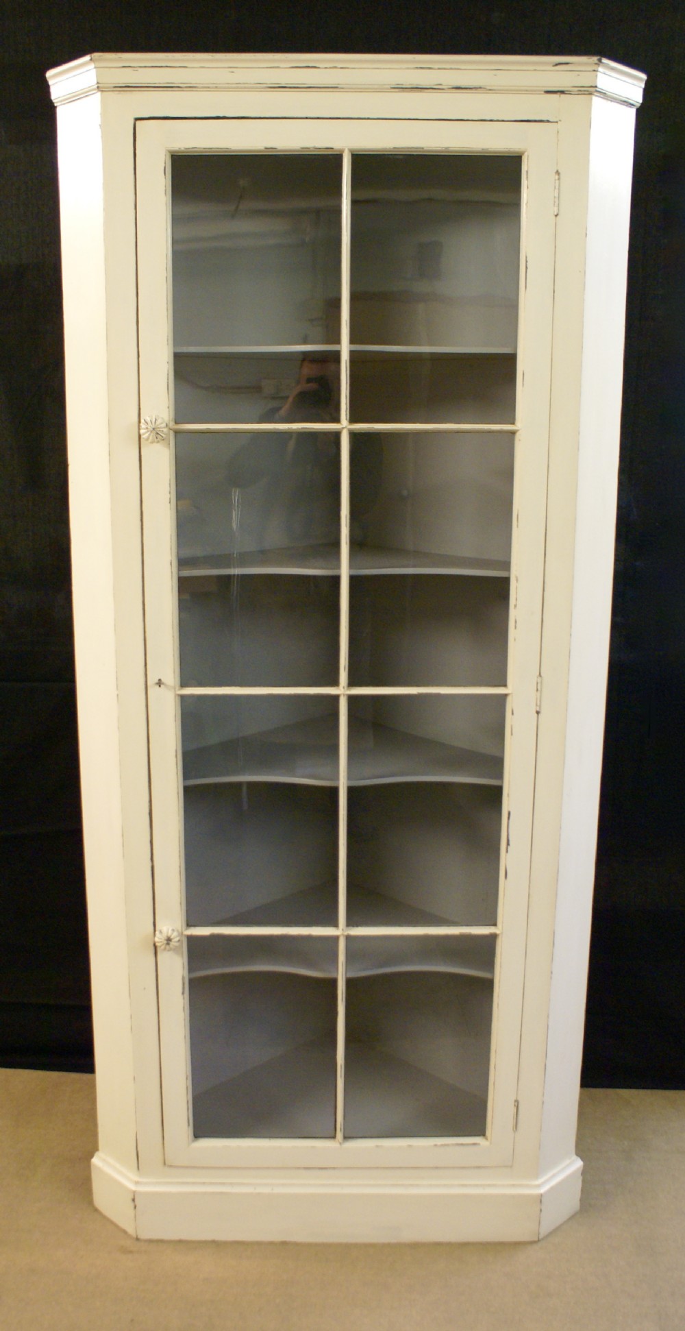 A very decorative 19th century painted free standing corner cupboard.