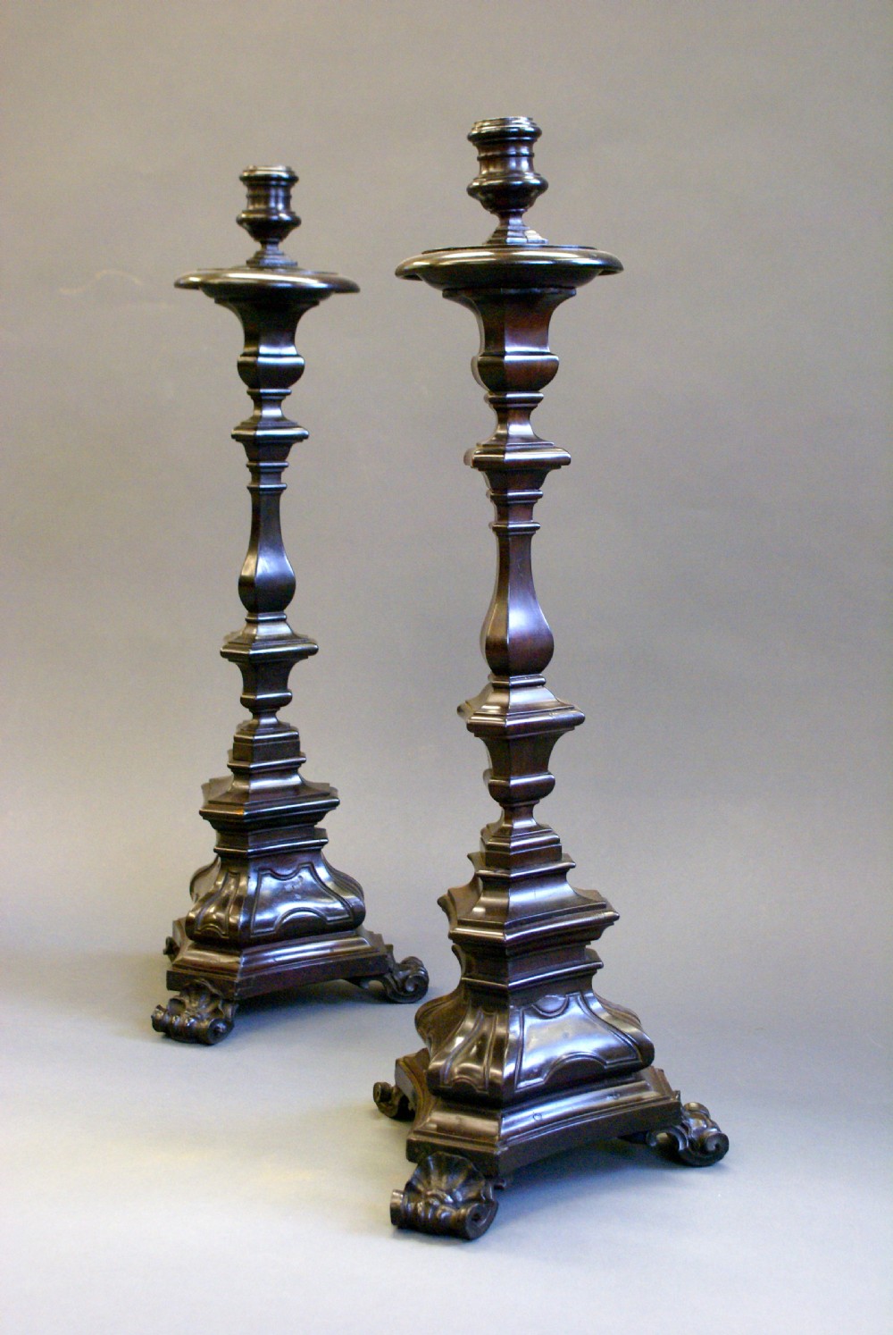 A very rare pair of early 18th century Portuguese solid Ebony candle sticks