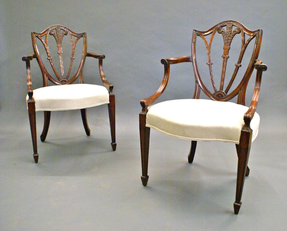 A fine pair of Hepplewhite Revival arm chairs.