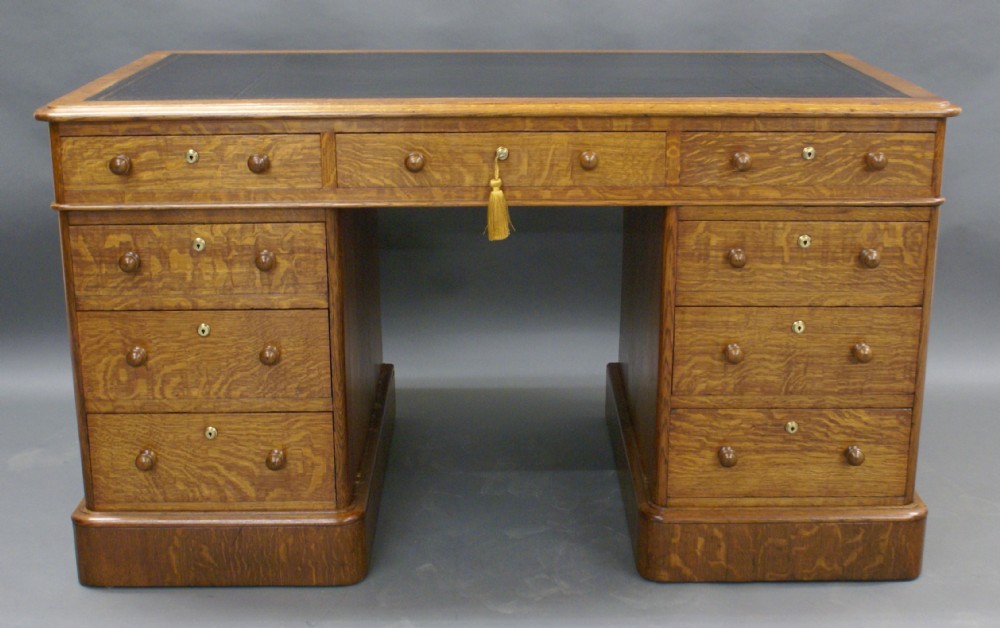 A Victorian oak pedestal desk