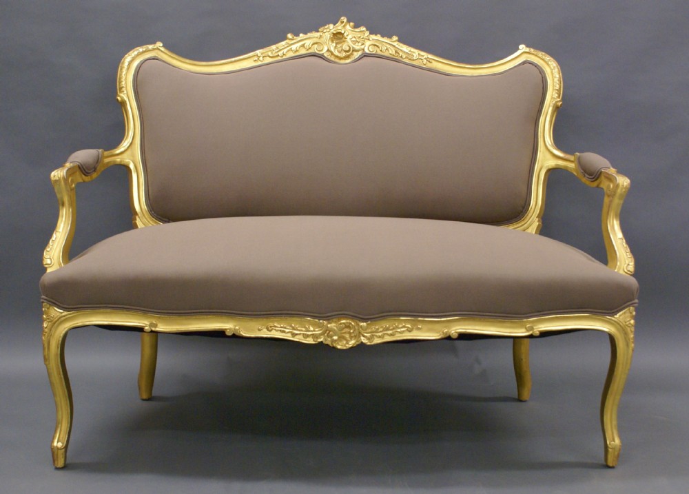 A highly decorative Venetian carved gilt wood sofa.