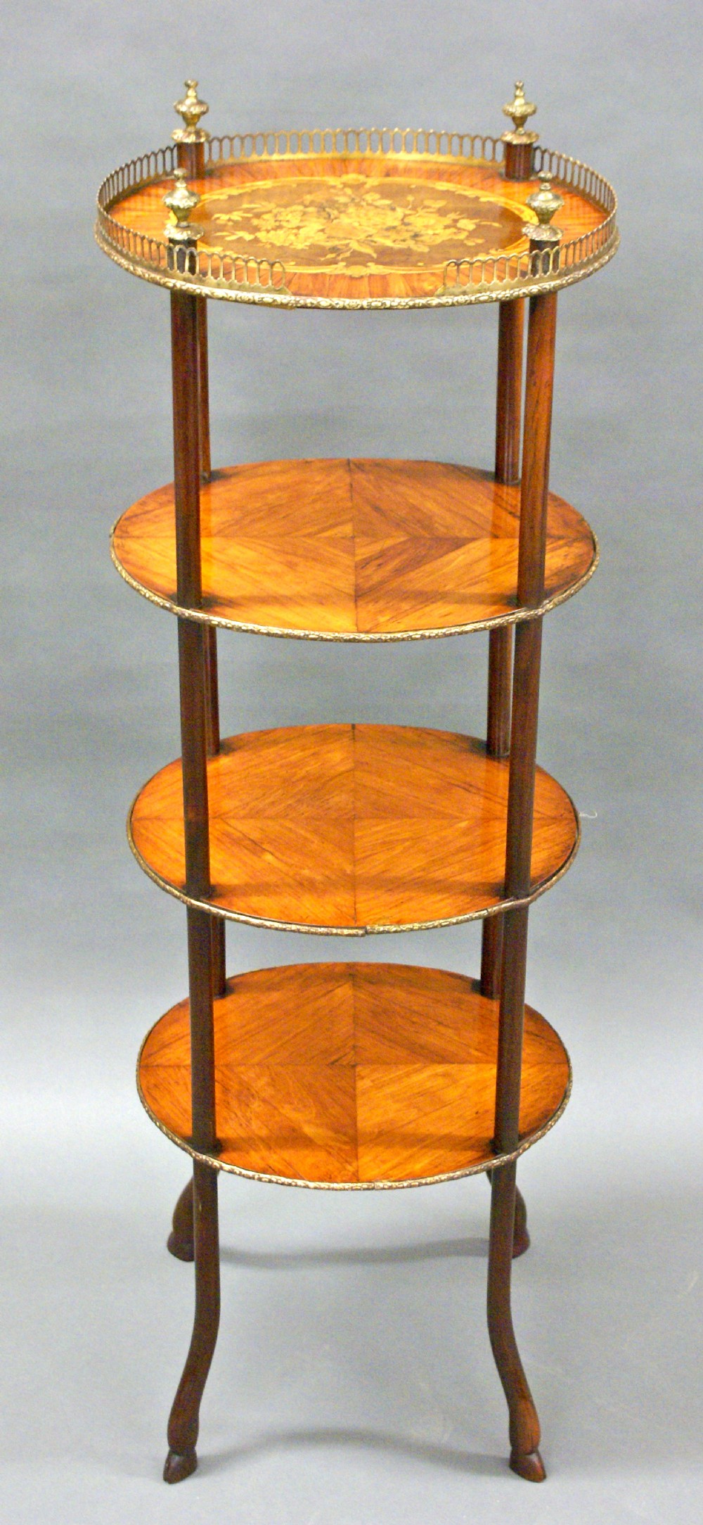 A quality 4 tier, oval, 19th century marquetry etagere.