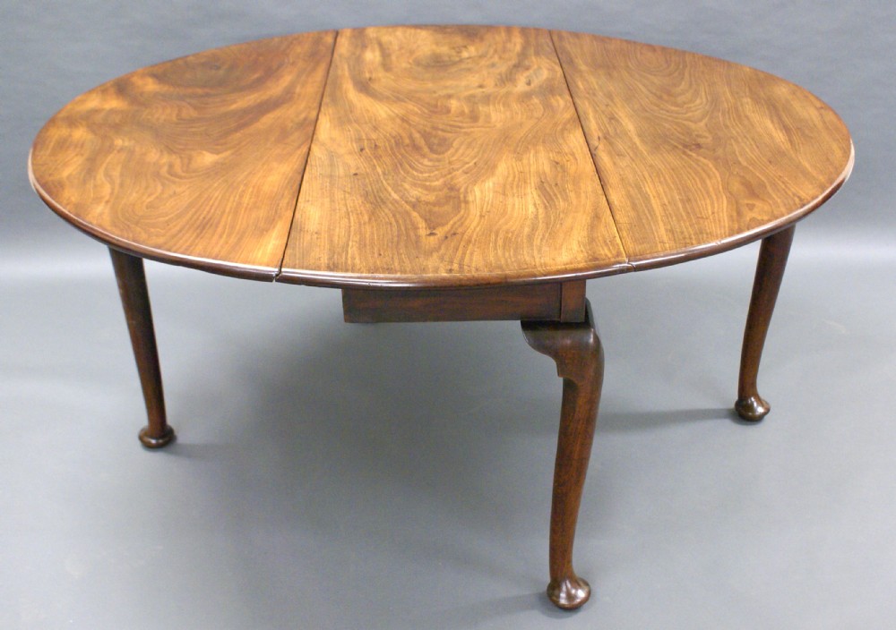 A George II gateleg table of exceptional colour.