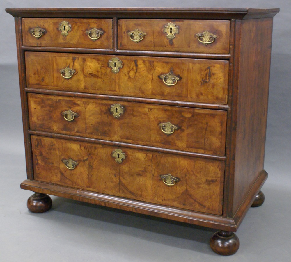 A William and Mary walnut veneered chest of drawers
