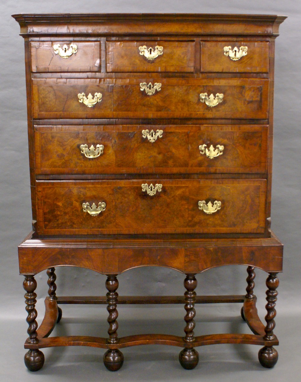 A George II walnut chest on stand