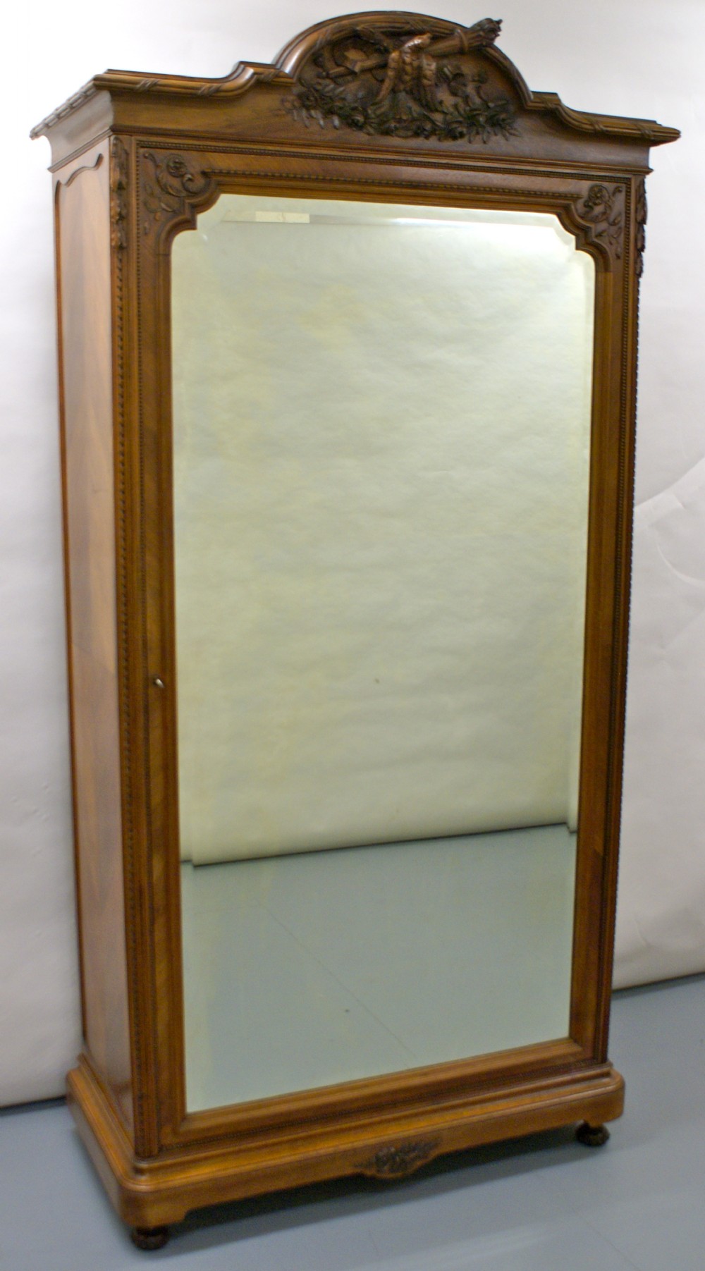 A superb quality French walnut single door wardrobe