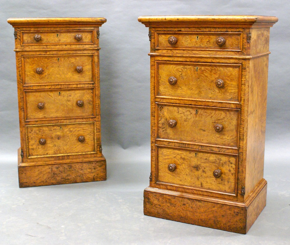 A pair of Burl Elm bedside chests, in the manner of Gillows.
