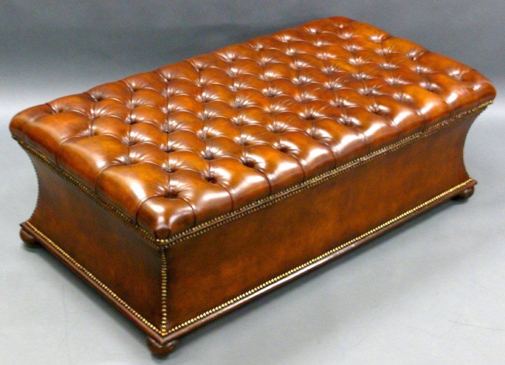 A superb Victorian rosewood and leather upholstered ottoman of impressive dimensions.