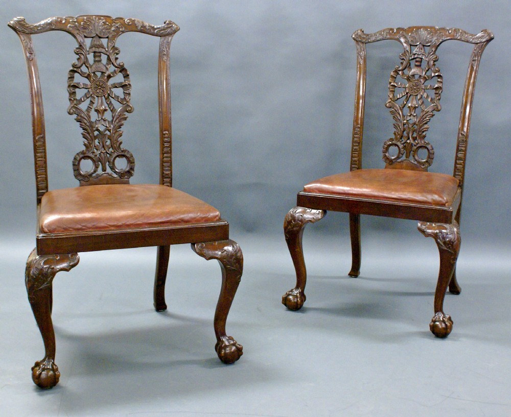 A stunning pair of Chippendale Revival side chairs