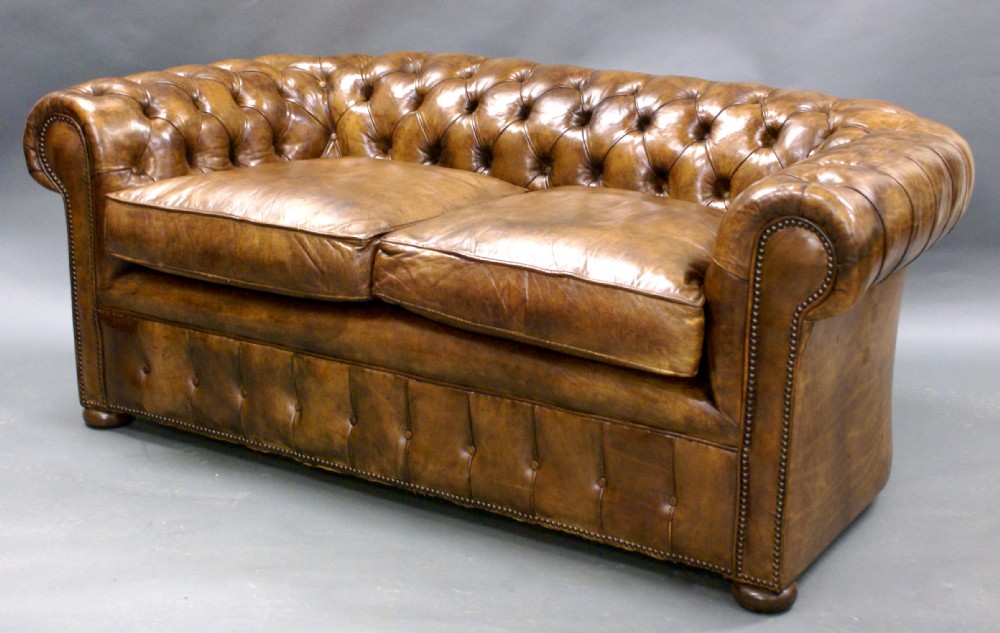 An early 20th century leather 2 seat chesterfield