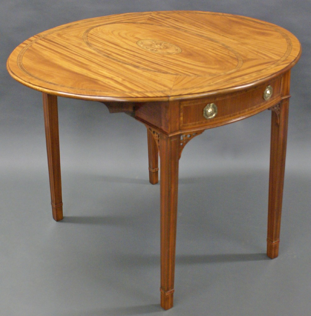 A 19th century oval satinwood Pembroke table