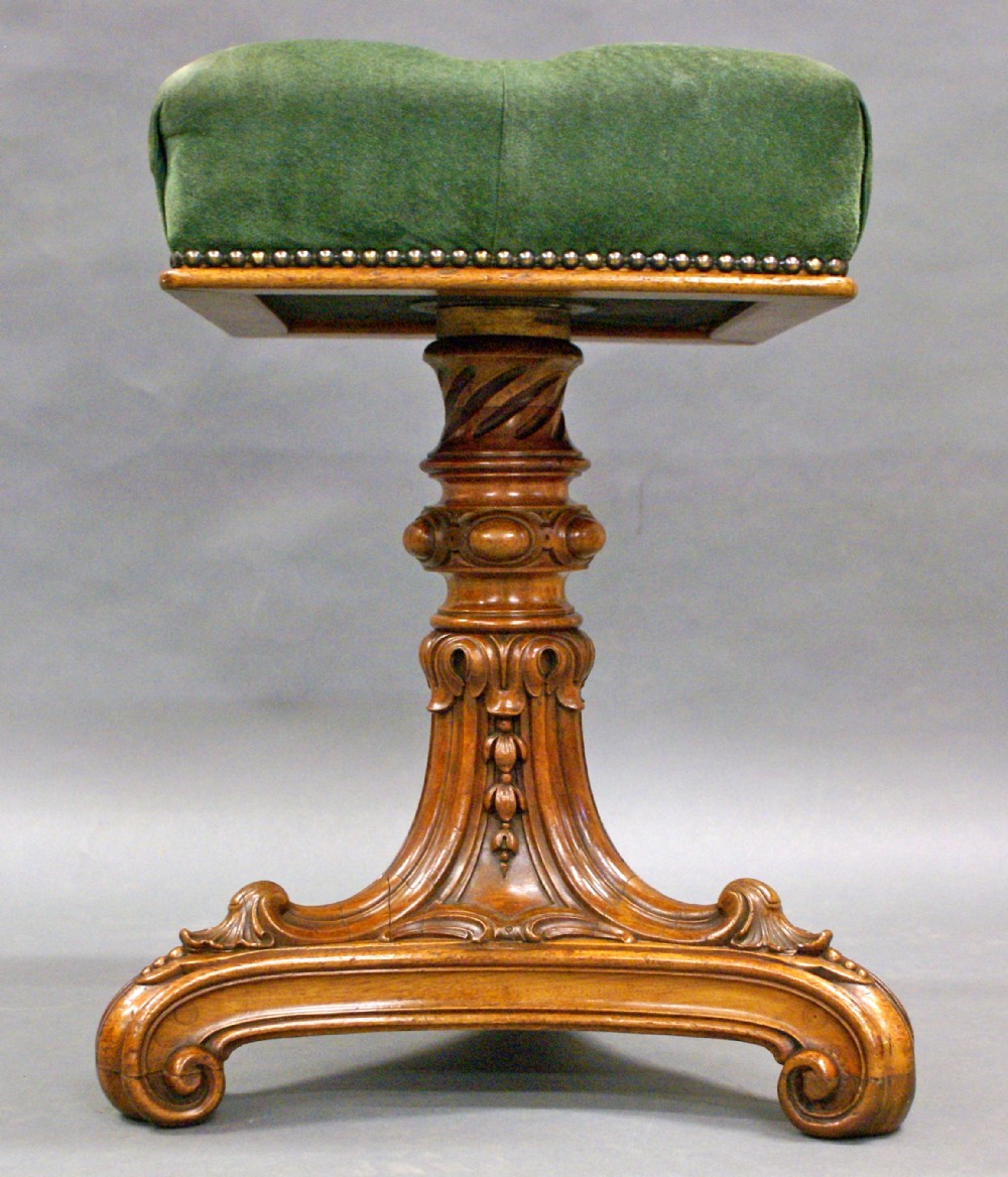 A beautifully carved walnut Victorian music stool