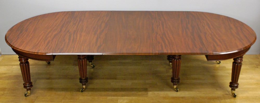 A late Regency mahogany extending dining table