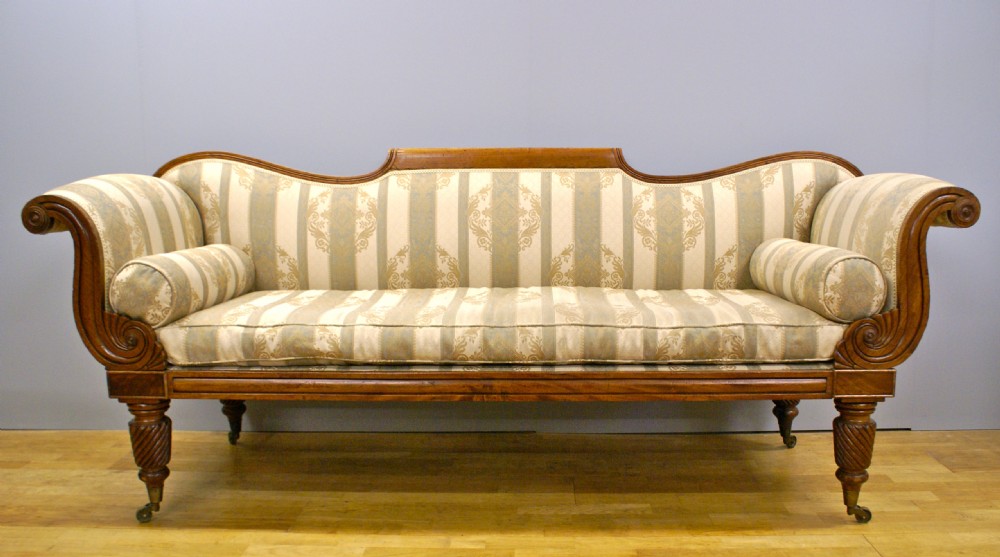 A late Regency mahogany scroll end sofa