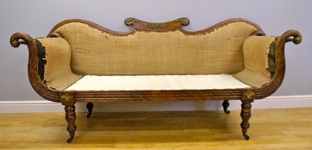 A Regency simulated rosewood scroll end sofa