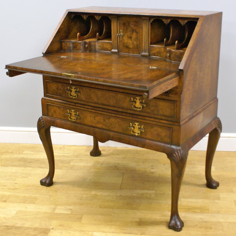 A Queen Anne style burl walnut bureau