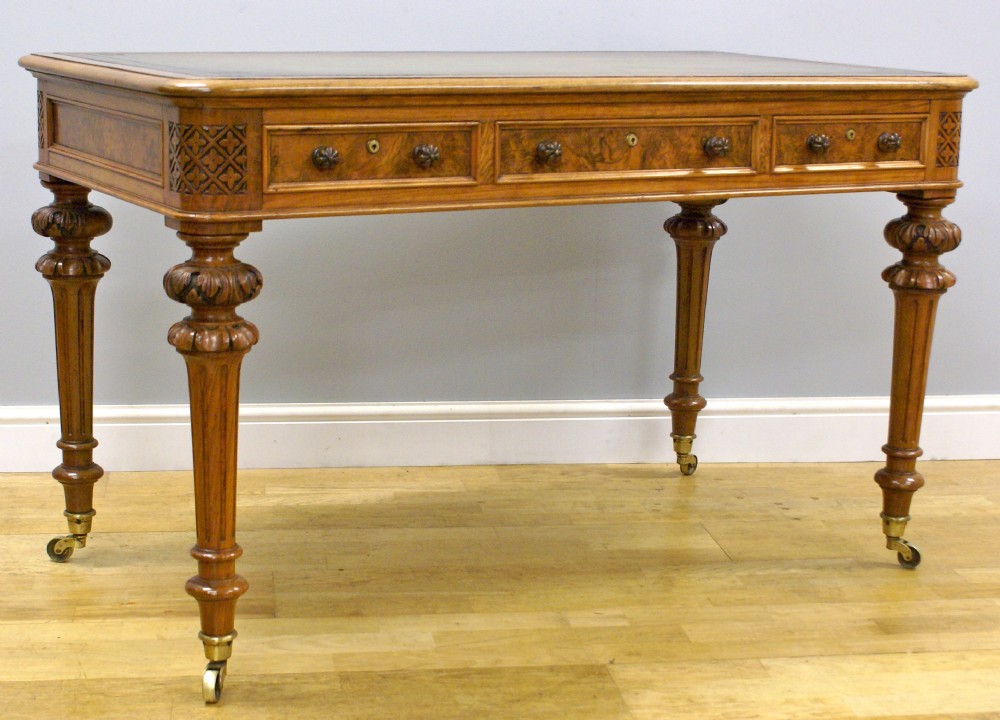 A superb High Victorian burl walnut writing table