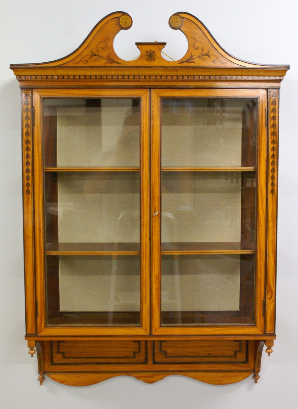 An Edwards & Roberts satinwood wall cabinet