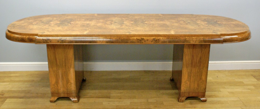 An Art Deco dining table of superb quality in burl walnut 