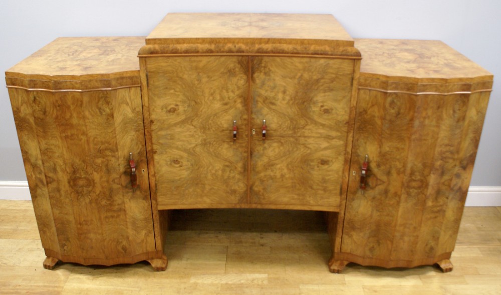 An Art deco burl walnut side board