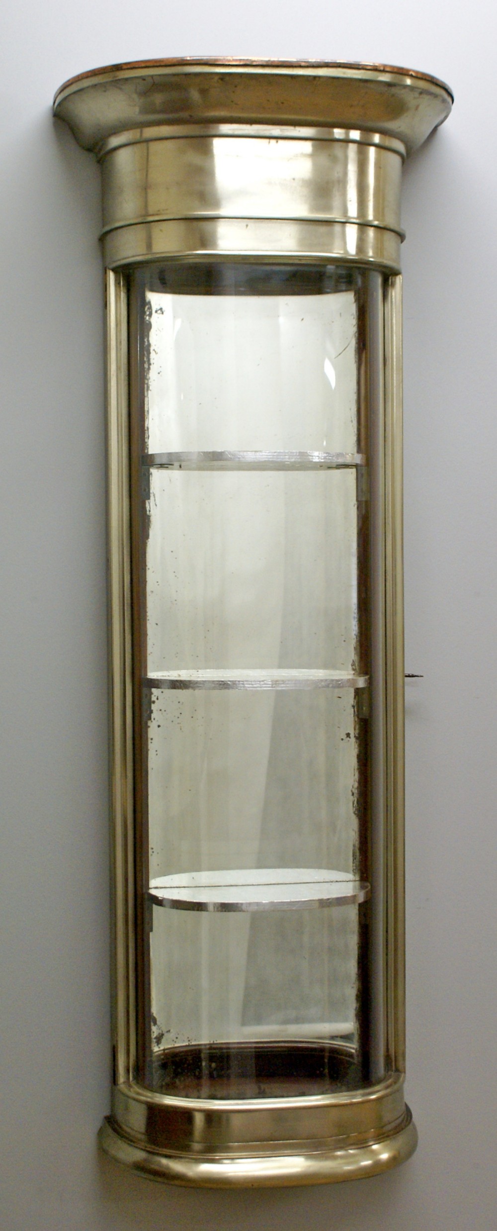 A mid 19th century steel wall mounted shop cabinet.