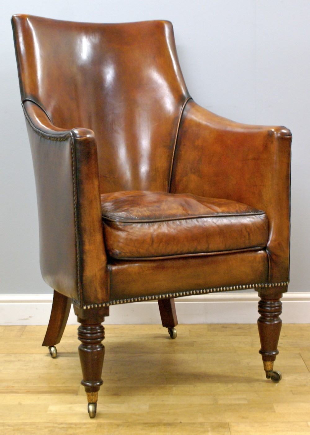 A George III mahogany library arm chair