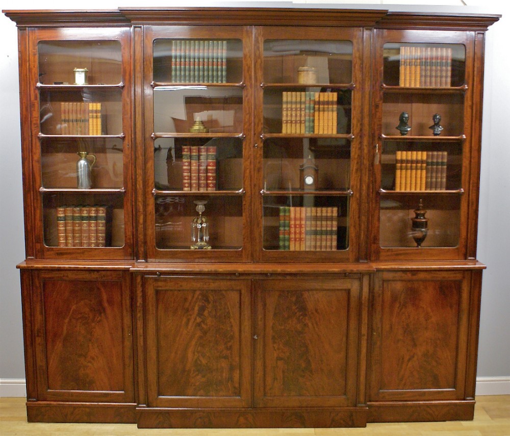 A William IV flame mahogany breakfront library bookcase