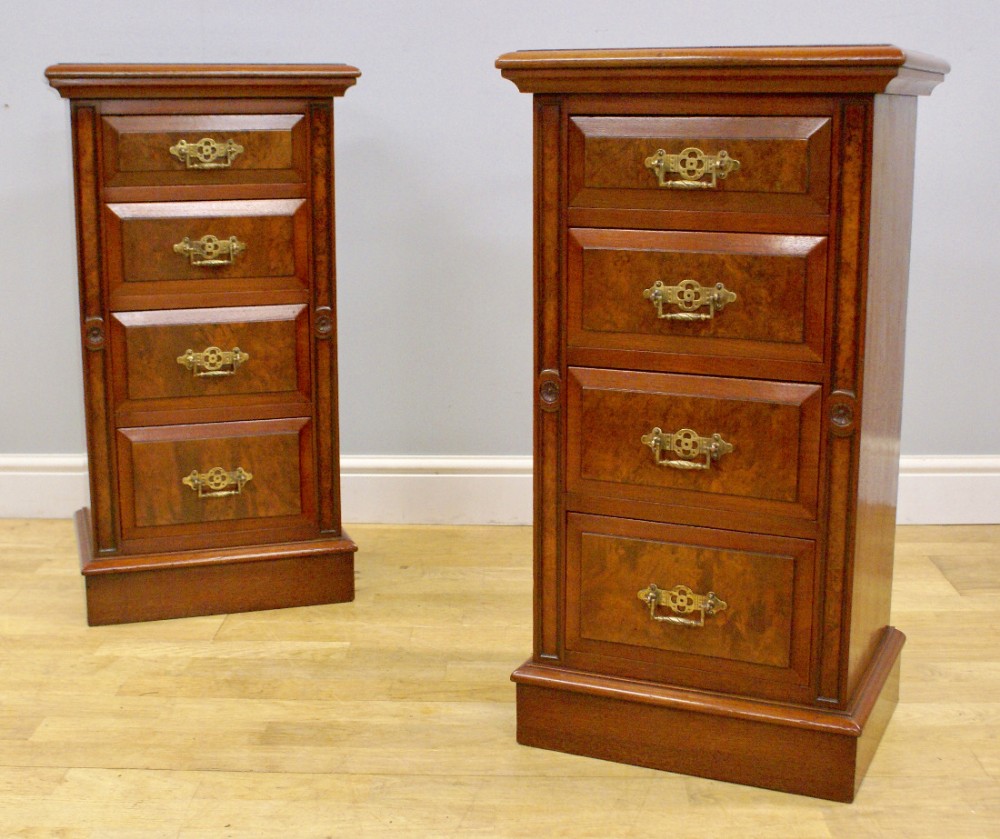 A pair of burl walnut bedside chests