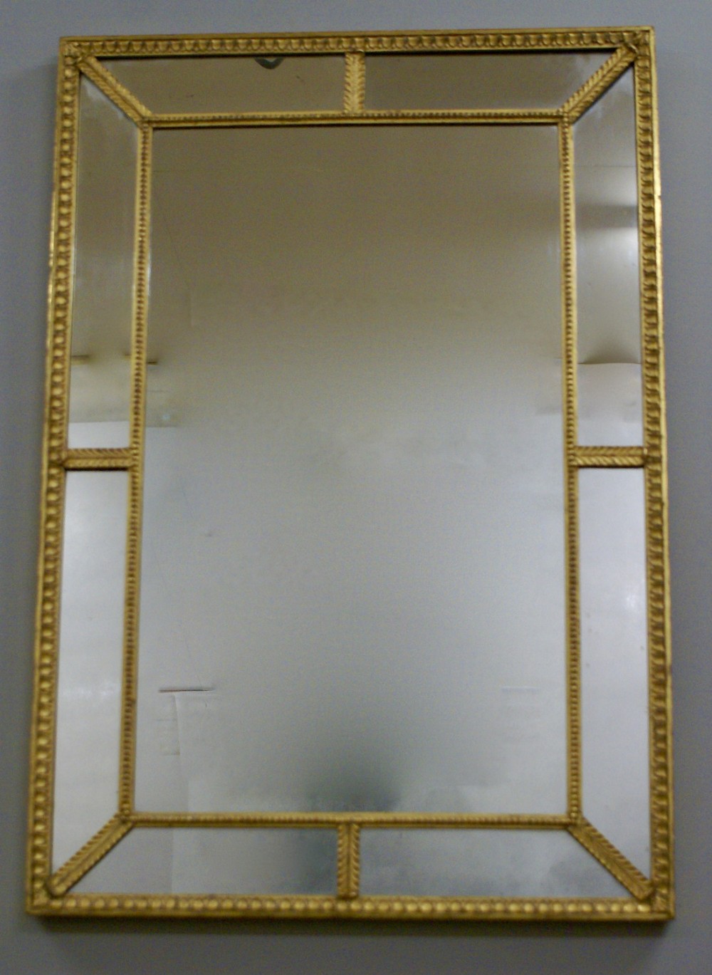 A carved wood and gilt English looking glass