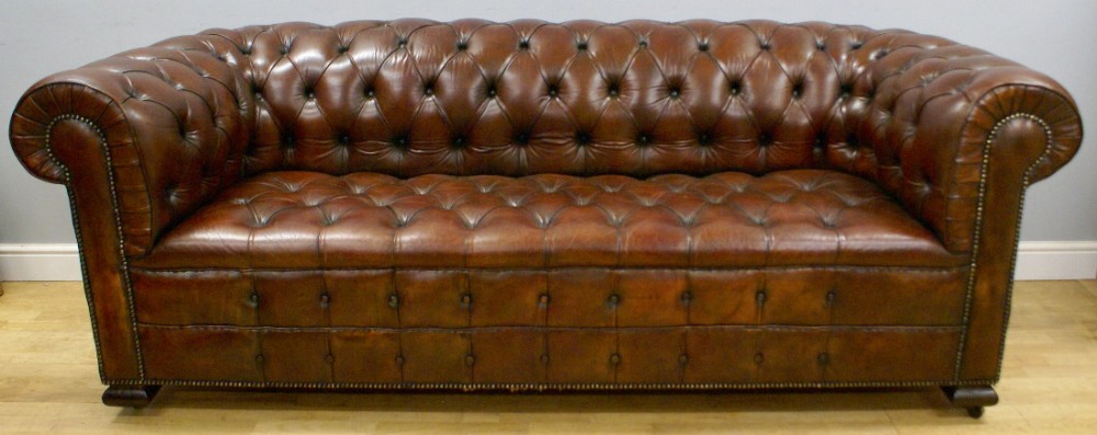 An Edwardian leather upholstered chesterfield.