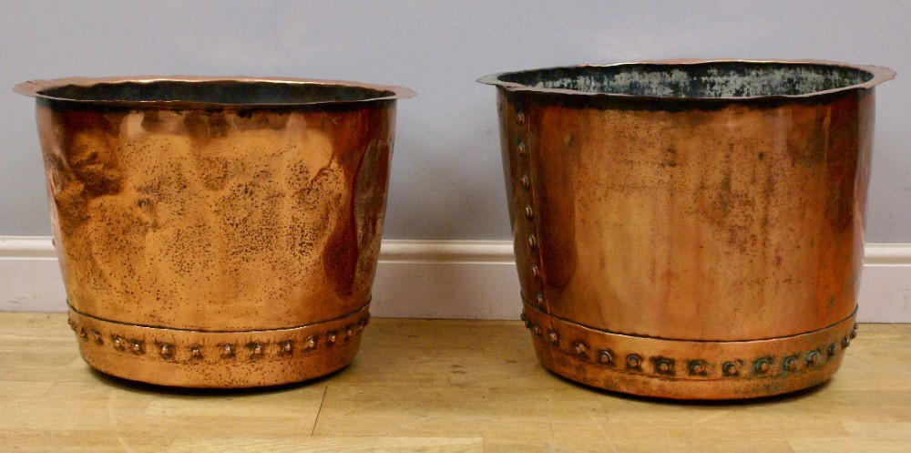 A matched pair of copper log bins