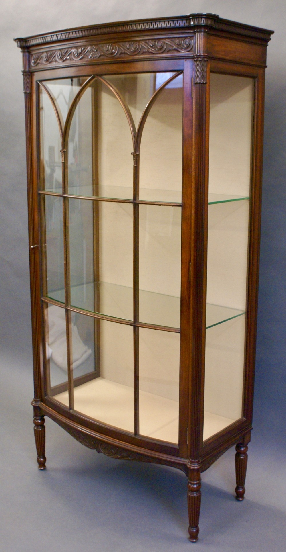 A Victorian mahogany bow-fronted display cabinet