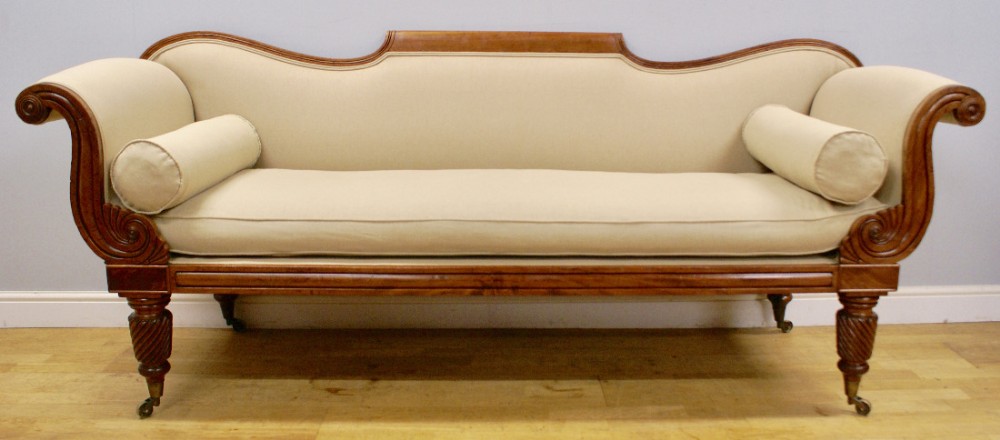 A late Regency mahogany scroll end sofa