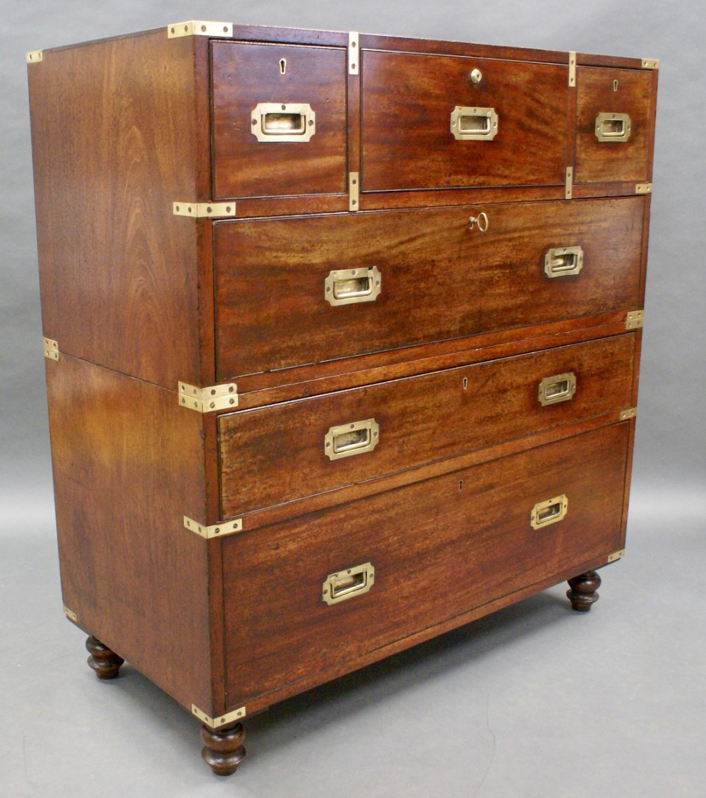 An exceptionally original mahogany military secretaire chest of drawers