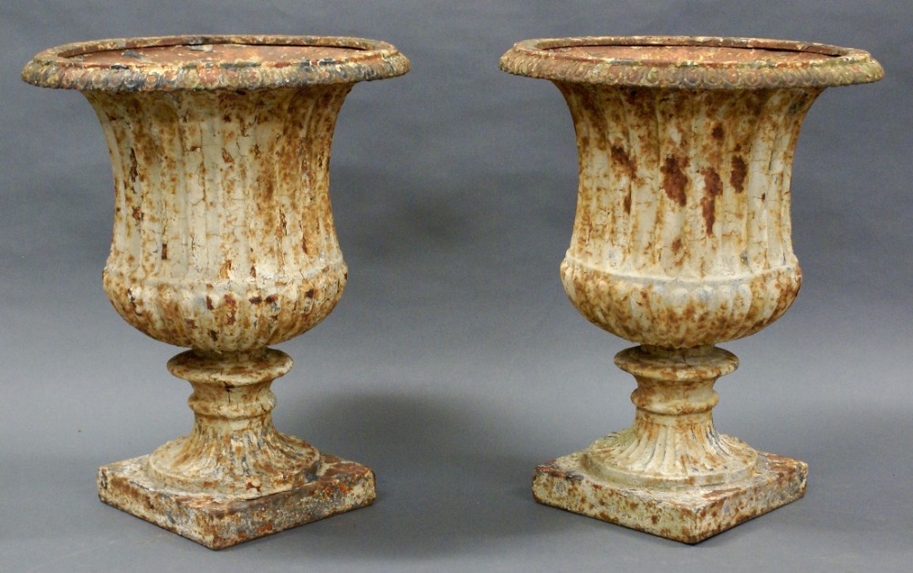 A pair of 19th century cast iron garden urns