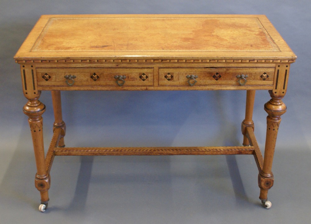 An Arts & Crafts inlaid writing table in the manner of Shoolbred. View VIII
