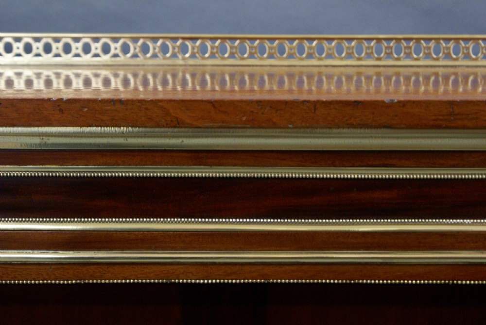 A superb open bookcase attributed to Holland & Son View VII