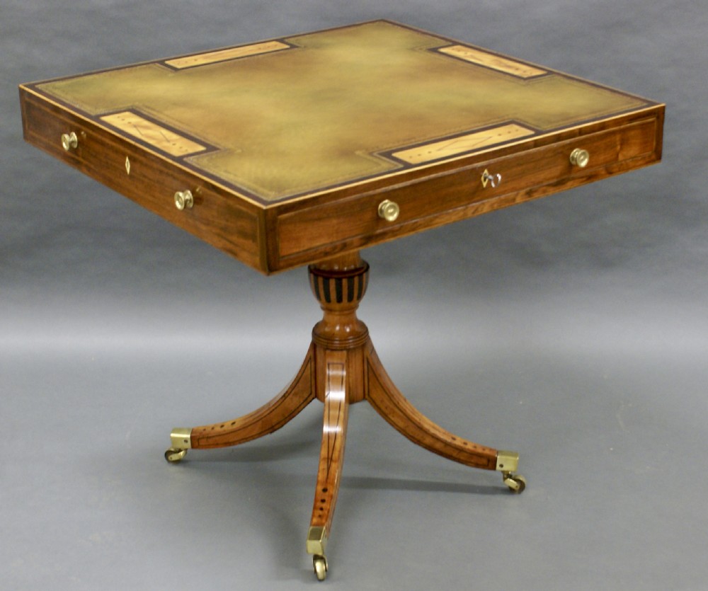 A George III rosewood and satinwood games table