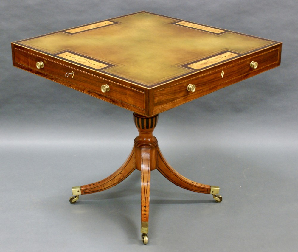 A George III rosewood and satinwood games table View III