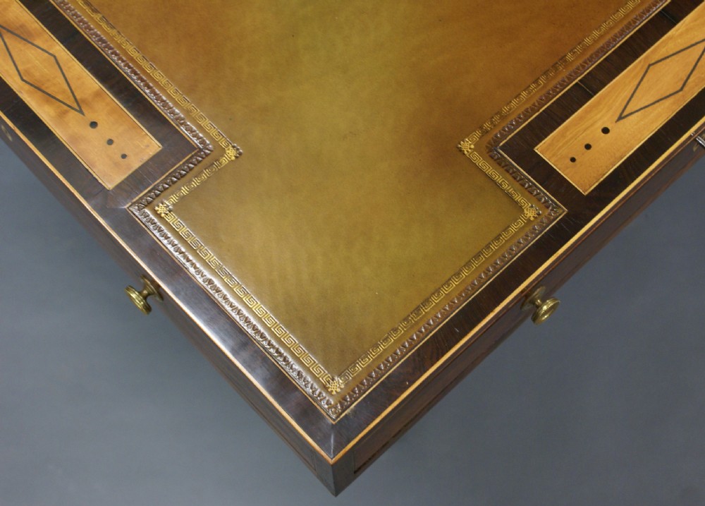 A George III rosewood and satinwood games table View VI