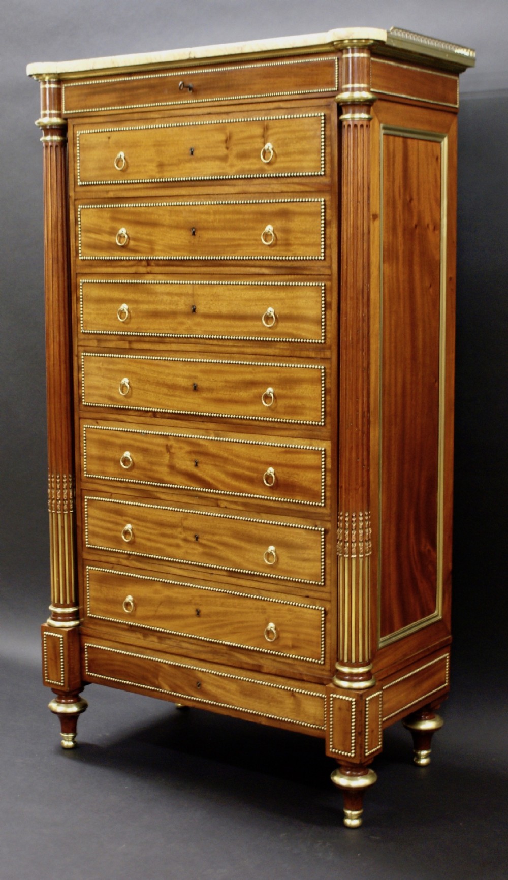 A fine French mahogany semainier (tall chest)