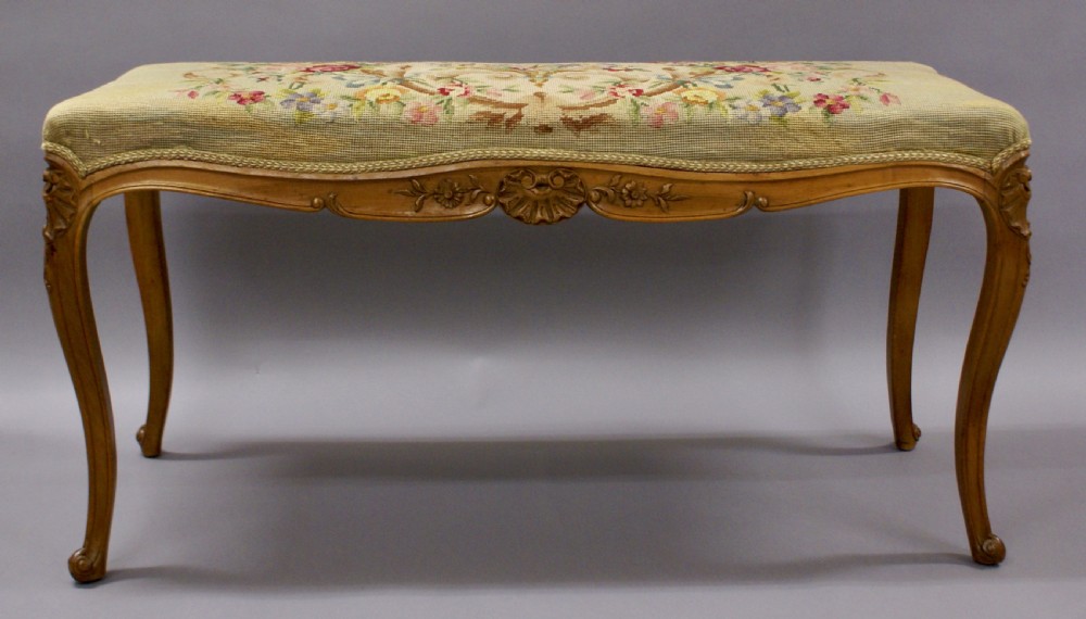 A Victorian stool with tapestry upholstery View II