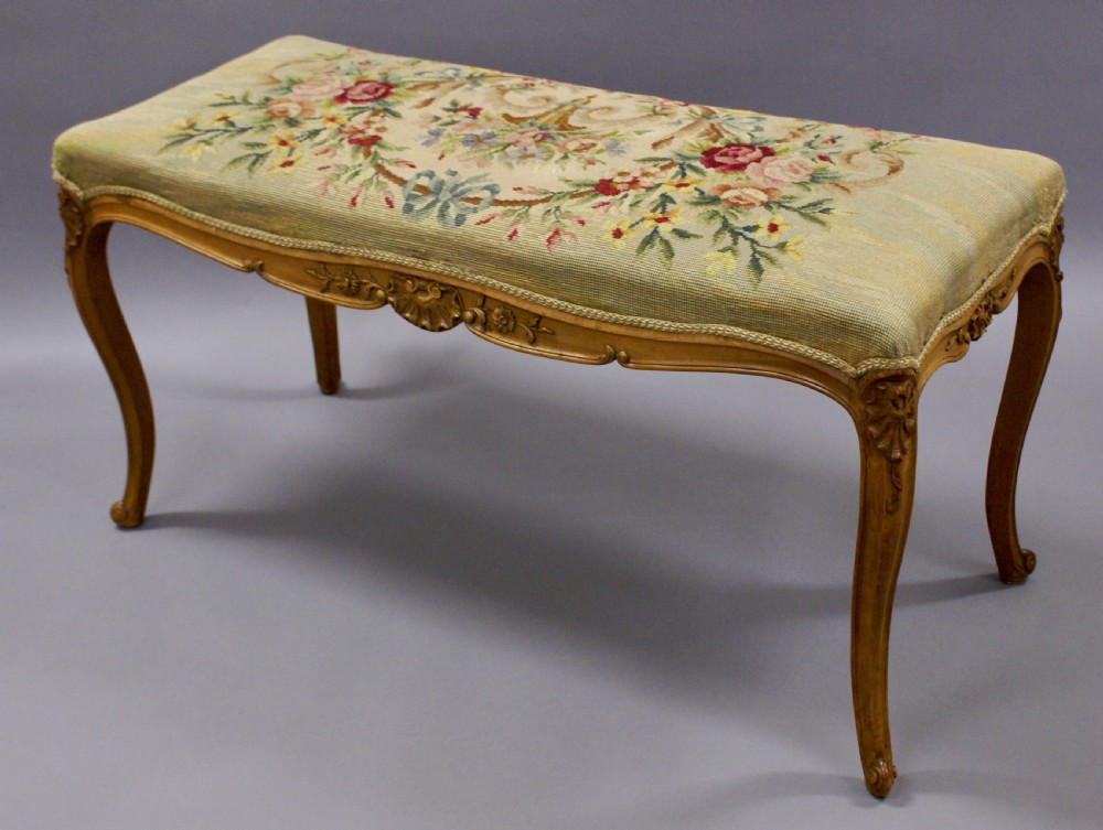 A Victorian stool with tapestry upholstery View III