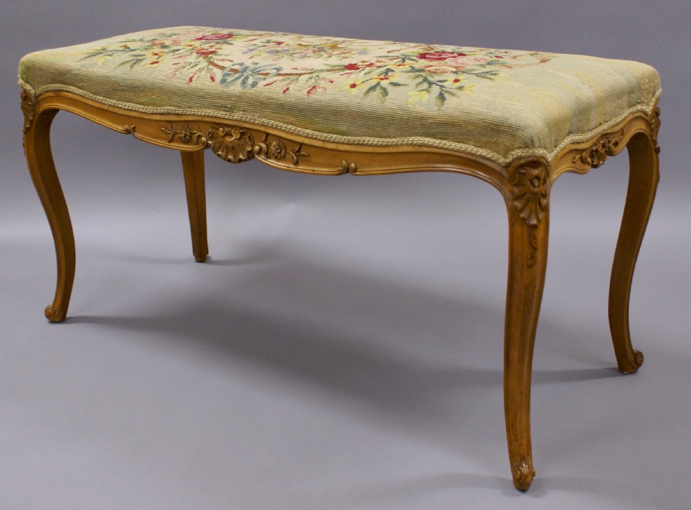 A Victorian stool with tapestry upholstery View VI