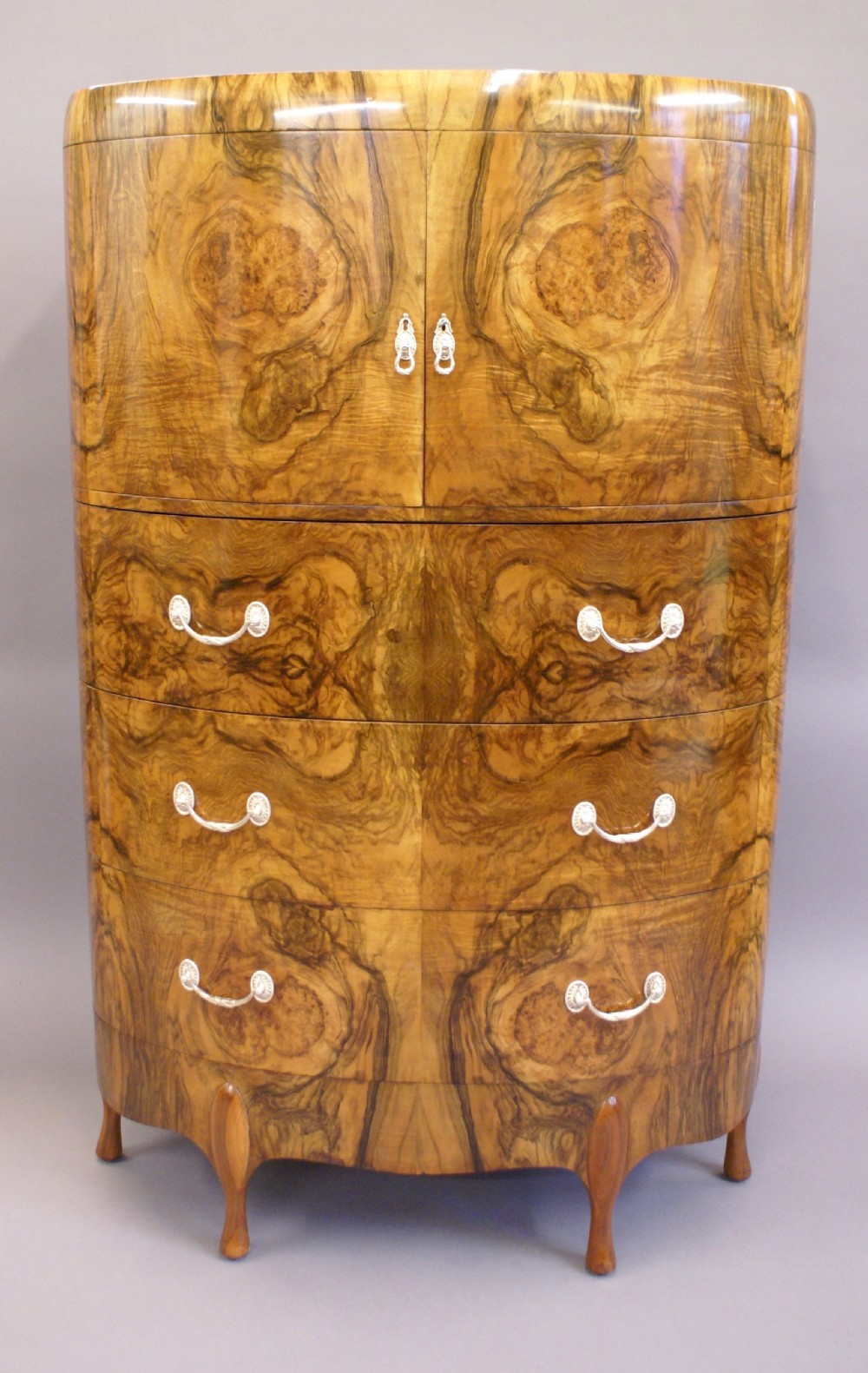 A tall Art Deco chest by Maurice Adams