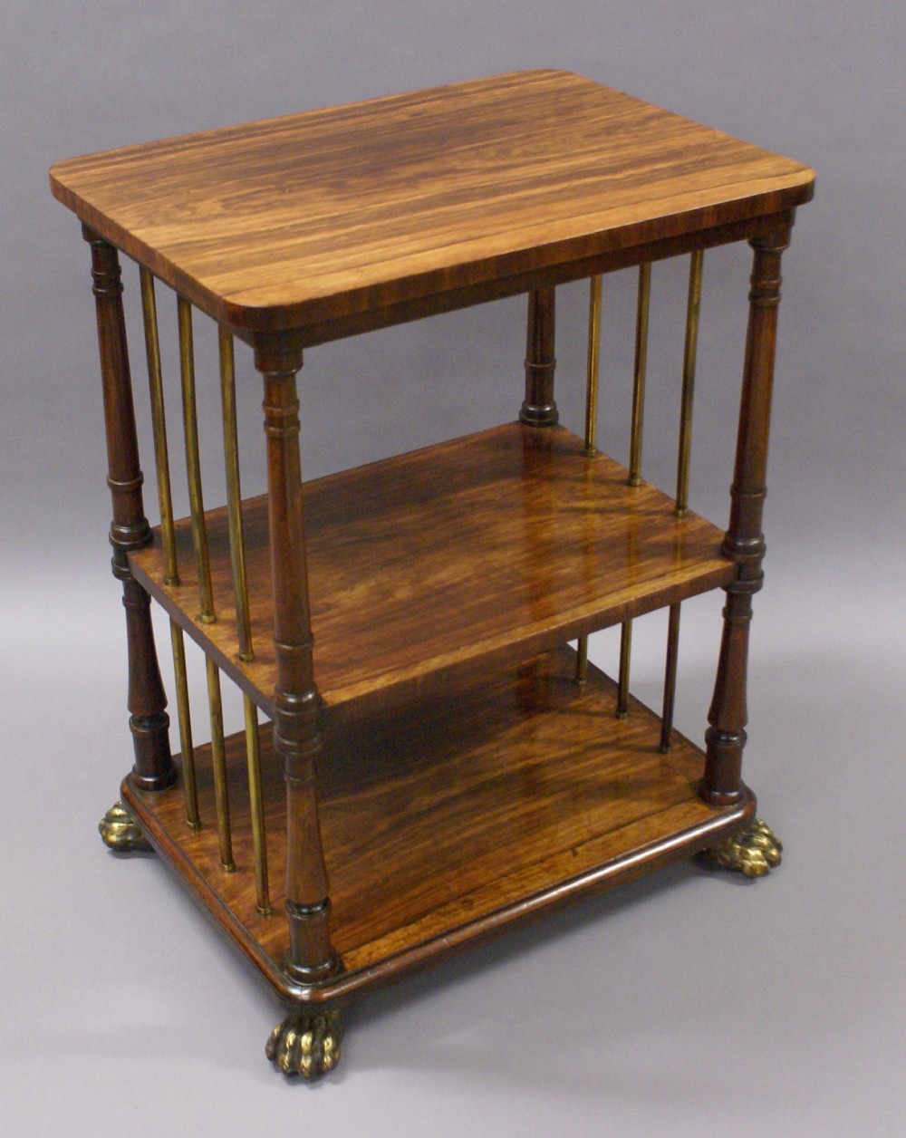 A Regency rosewood and brass etagere