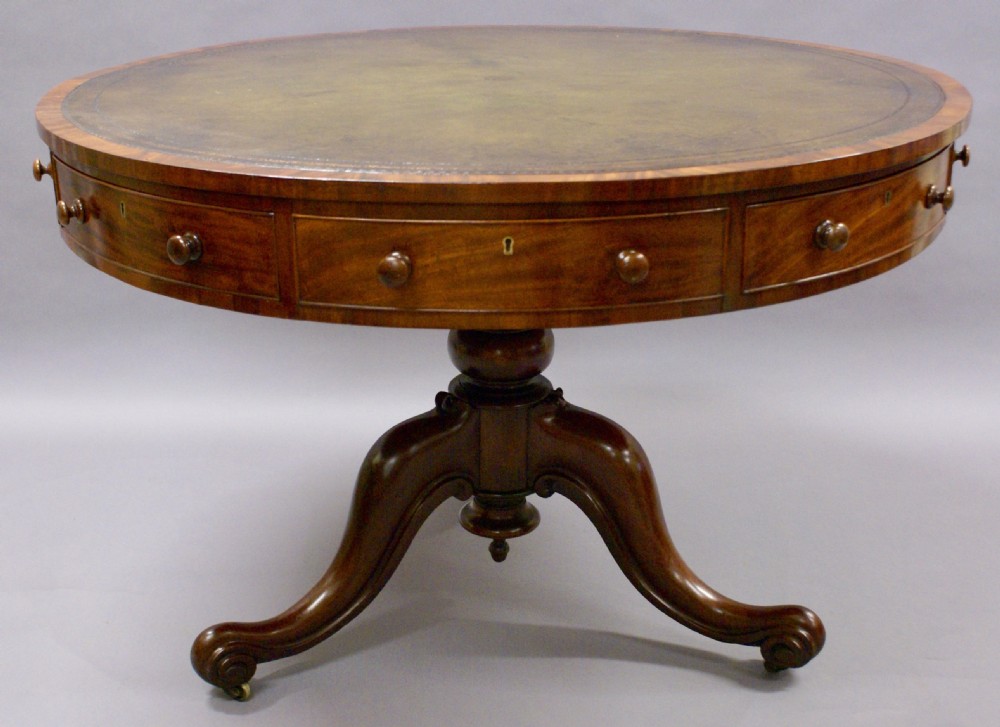 A mid 19th century mahogany drum table