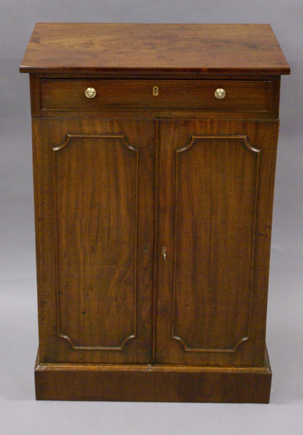 A small George III cupboard